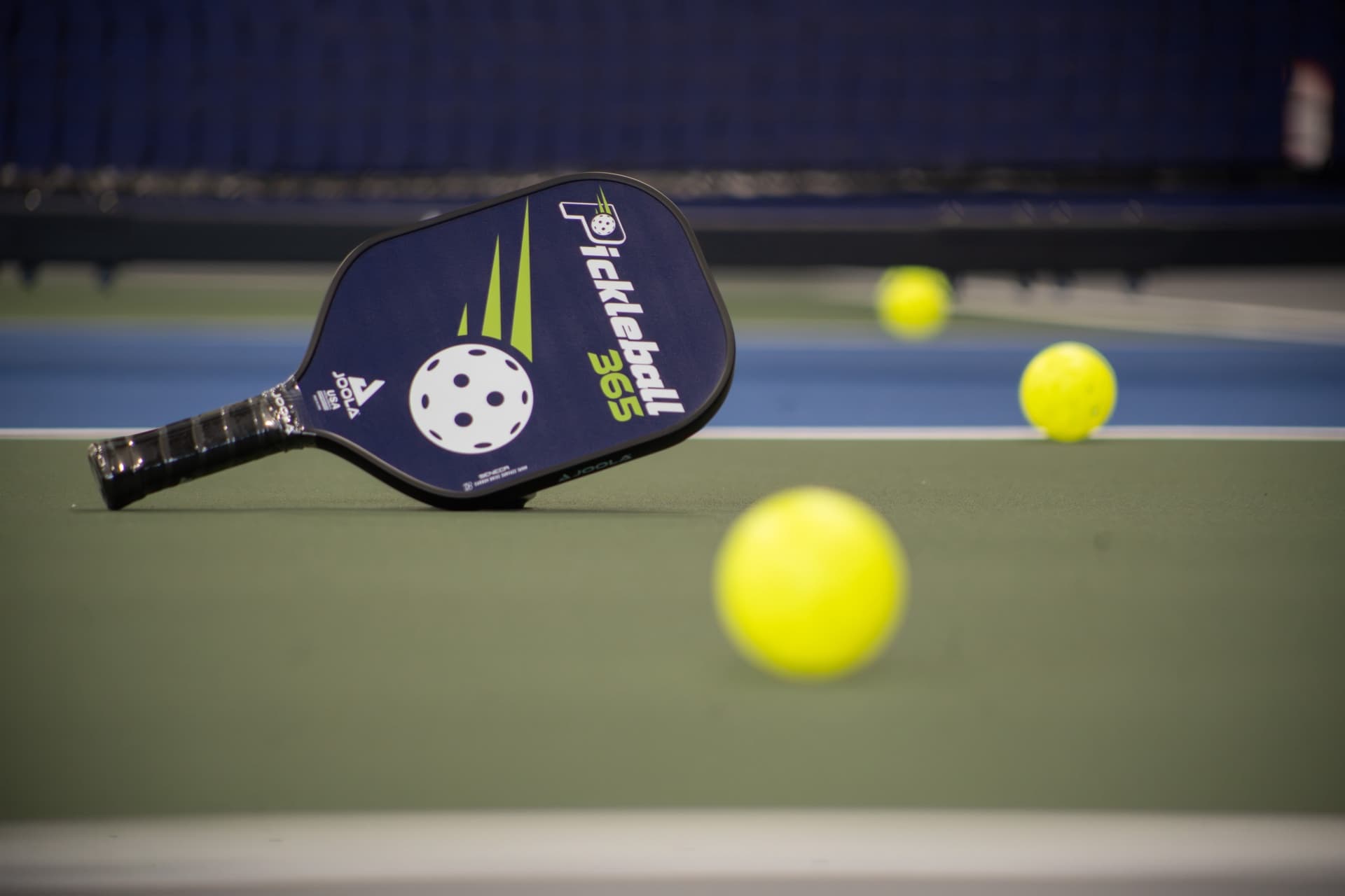 Pickleball paddle and ball closeup